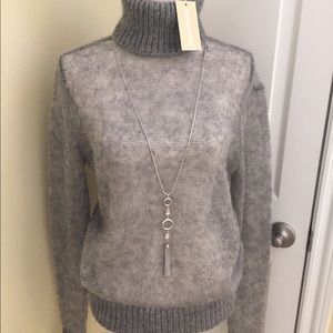 MICHAEL KORS... sheer turtle neck sweater.